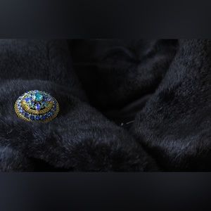 Vintage, gold plated brooch with blue stones.